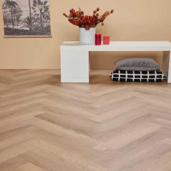 Light wood herringbone pattern flooring